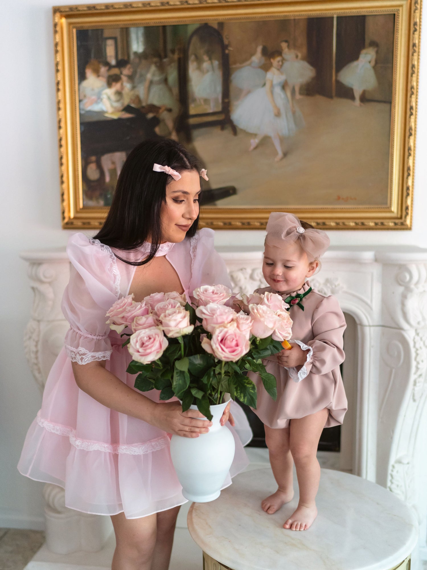 Mum & Daughter holding flowers in romantic setting